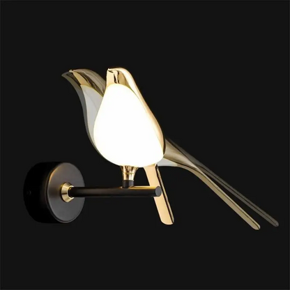 Modern bird-inspired wall light with gold acrylic finish and warm white LED