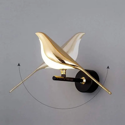 Modern bird-inspired wall light with gold acrylic finish and warm white LED